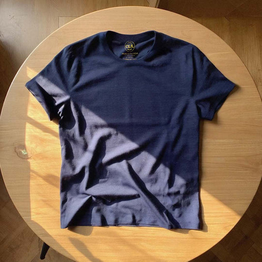 The Basic Tee in navy, soft micro-modal fabric, raw-edged and custom-fit.